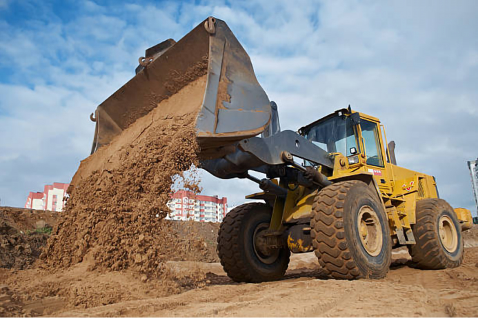 Construction equipment yard with various machinery